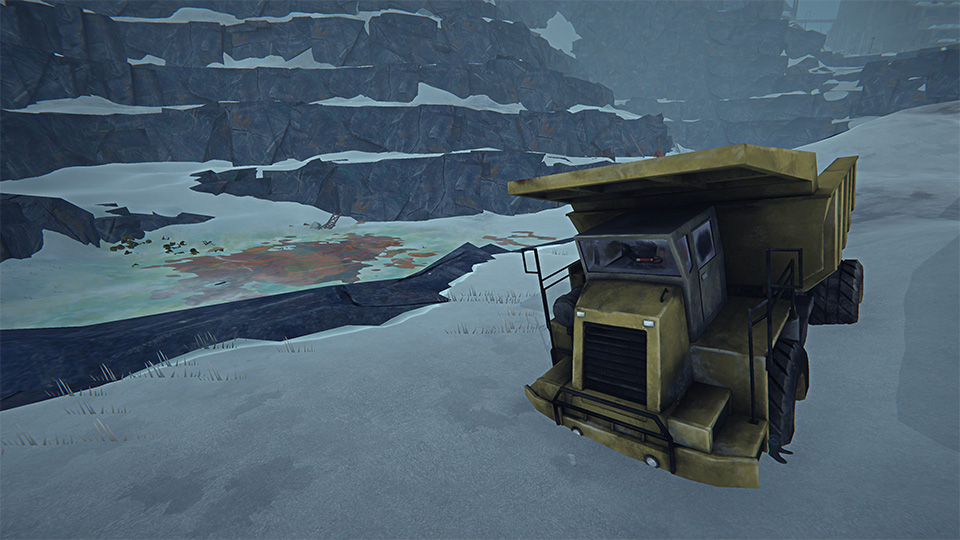 A large yellow industrial mining truck parked on snowy ground with contaminated ice patches in the background.